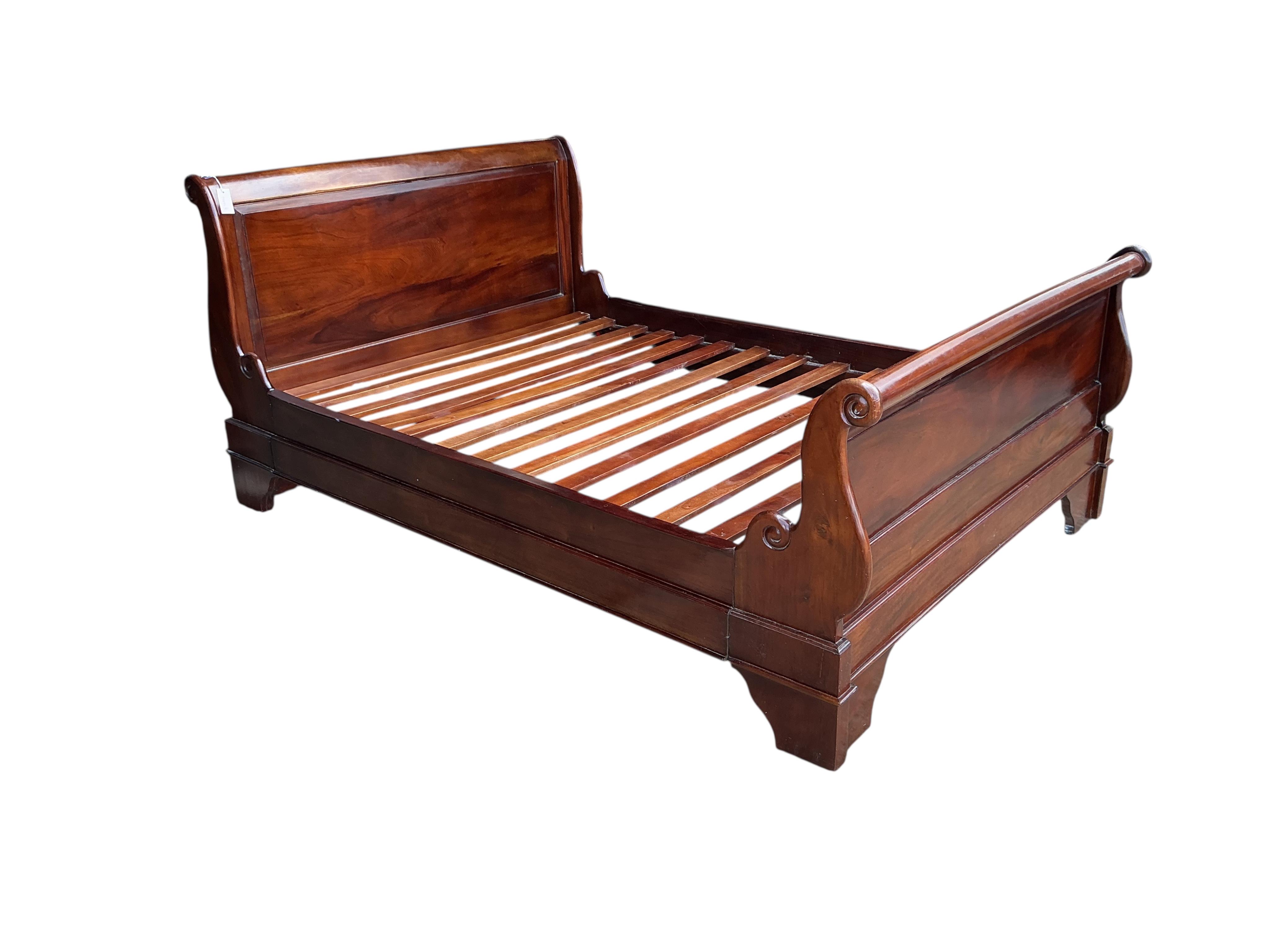 A reproduction mahogany sleigh bed, width 144cm, height 99cm